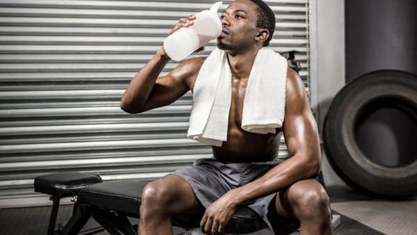 Black Man Drinking Vegan Protein Powder Vs Whey